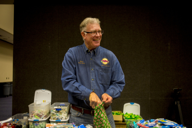 Henderson Mayor Andy Hafen fills stockings for troops serving overseas during the 8th annual &quot;Stockings for our Troops,&quot; at Henderson City Hall, Tuesday, Nov. 29, 2016, in Hender ...