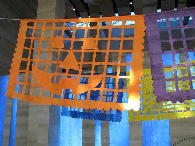 Justin Favela's installation &quot;Patrimonio&quot; is set to be on display through Dec. 15 at Las Vegas City Hall’s Grand Gallery. The paper flags reference holidays including Hall ...
