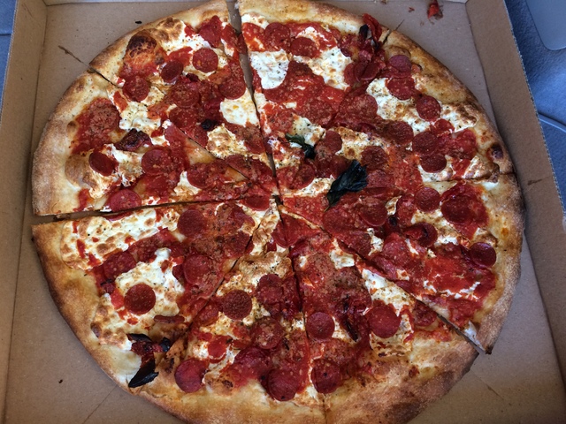 Grimaldi's pizza with pepperoni and Roma tomatoes is seen at the Boca Park location. Jan Hogan/View