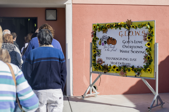 Volunteers stand in line at St. Thomas More Catholic Community in Henderson to deliver meals to seniors on Thanksgiving, Thursday, Nov. 24, 2016, Las Vegas. Elizabeth Page Brumley/Las Vegas Review ...