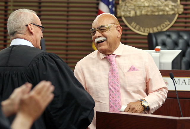 U.S. Army veteran Albert Gutierrez, right, exchanges a smile with Judge Mark Stevens during a Veterans Treatment Court graduation ceremony June 16, 2016, in Henderson. View file photo