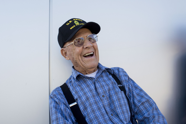 Les Burgwardt, a WWII and Korea veteran, has a deep belly laugh after reuniting with an old friend and neighbor who also served in WWII in Henderson on Saturday. (Elizabeth Page Brumley/Las Vegas  ...