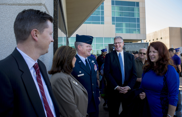 Col. Paul J. Murray from Nellis Air Force Base, center, and Henderson Mayor Andy Hafen, right, talk at the Veterans Memorial Wall at the Henderson Events Plaza amphitheater Saturday, Nov. 5, 2016. ...