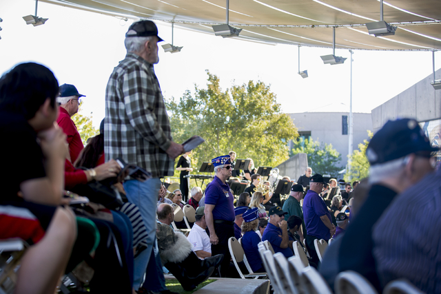 Veterans stand to be honored while the Henderson Symphony Orchestra plays during the Veterans Day Ceremony at the Henderson Events Plaza amphitheater Saturday morning, Nov. 5, 2016. Elizabeth Page ...