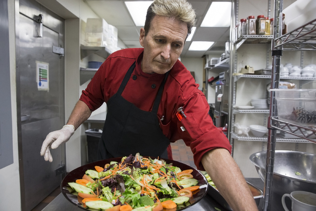 Cook Tim Walsh prepares a salad at KIT's Kitchen on Thursday, Nov. 17, 2016, in Henderson. (Benjamin Hager/Las Vegas Review-Journal)