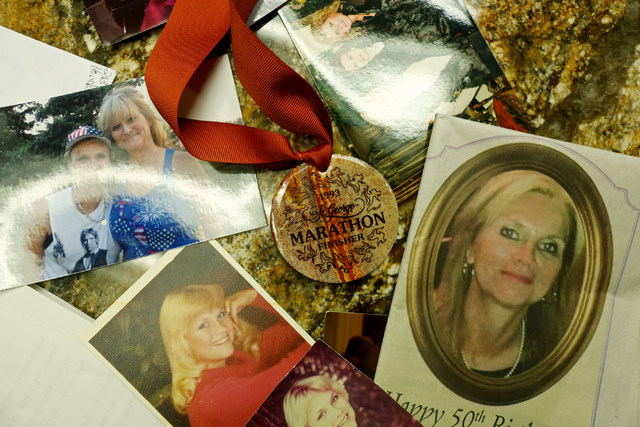 Photos of Susan Winters, along with a marathon medal, are scattered on a table at the law firm of Anthony Sgro on Sept. 7, 2016, in Las Vegas. Elizabeth Page Brumley/Las Vegas Review-Journal Follo ...