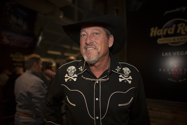 Greg McKinney shows off his skull and crossbones shirt at the National Finals Rodeo at Thomas & ...