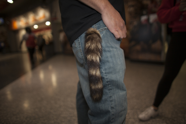 John Sweet shows off his raccoon tail keychain at the National Finals Rodeo at Thomas & Mac ...