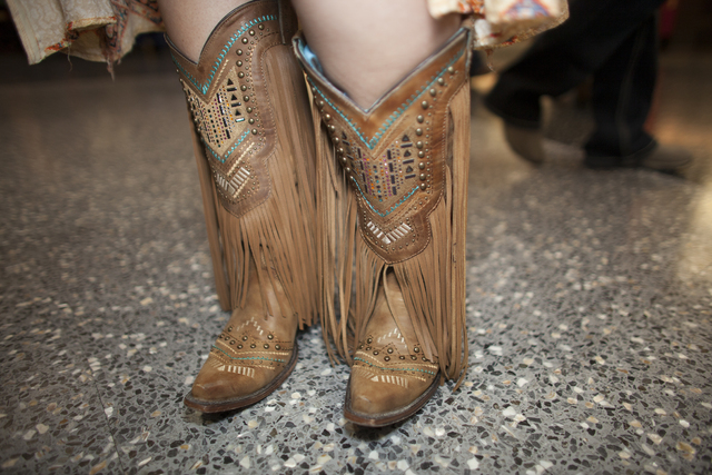 Jessica Thomas shows off her boots at the National Finals Rodeo at Thomas & Mack Center on ...