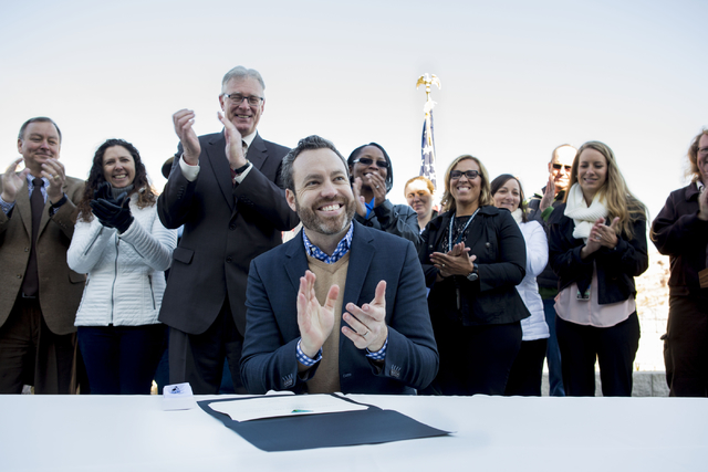 Neil Kornze, center, director, Bureau of Land Management,  signs a proclamation of the Round 16B Funding for  $80 million, at the Red Rock Canyon National Conservation Area Visitor Center, Wednesd ...
