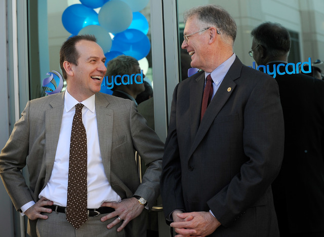 Barclaycard COO Patrick Wright, left and Henderson Mayor Andy Hafen share a laugh as the two attend the ribbon cutting ceremony Barclaycard call center in Henderson on Thursday, Feb. 13, 2014. (Da ...