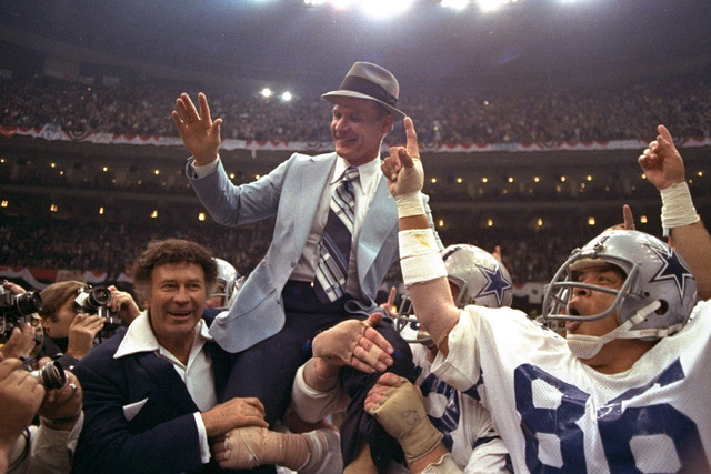 In this Jan. 15, 1978, file photo, Dallas Cowboys head coach Tom Landry is given a victory ride after the team defeated the Denver Broncos in NFL football's Super Bowl XII in New Orleans. (File/AP)