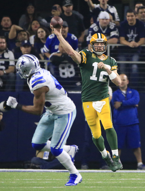 Green Bay Packers' Aaron Rodgers throws during the second half of an NFL divisional playoff football game against the Dallas Cowboys Sunday, Jan. 15, 2017, in Arlington, Texas. (Ron Jenkins/AP)