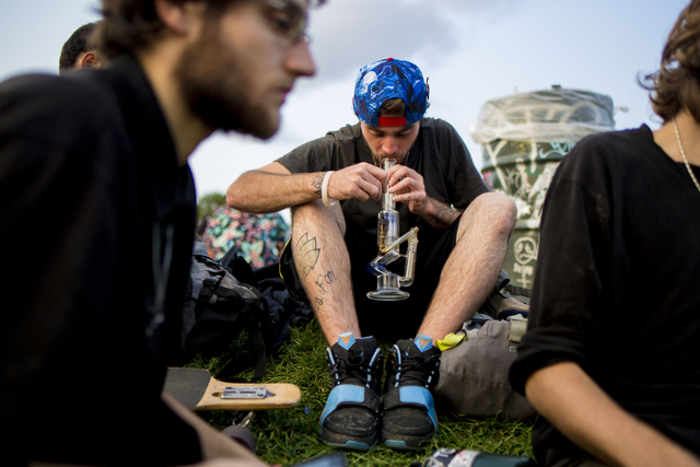Teenagers take turns taking hits takes of marijuana in Commons Park, Wednesday, Aug. 31, 2016, in Denver. Elizabeth Page Brumley/Las Vegas Review-Journal Follow @ELIPAGEPHOTO