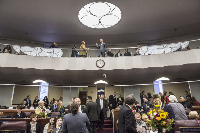Nevada Senate Majority Leader Aaron Ford, top/middle, interacts with guests before the start of the first day of the Nevada Legislative session on Monday, Feb. 6, 2017, at the Legislative Building ...