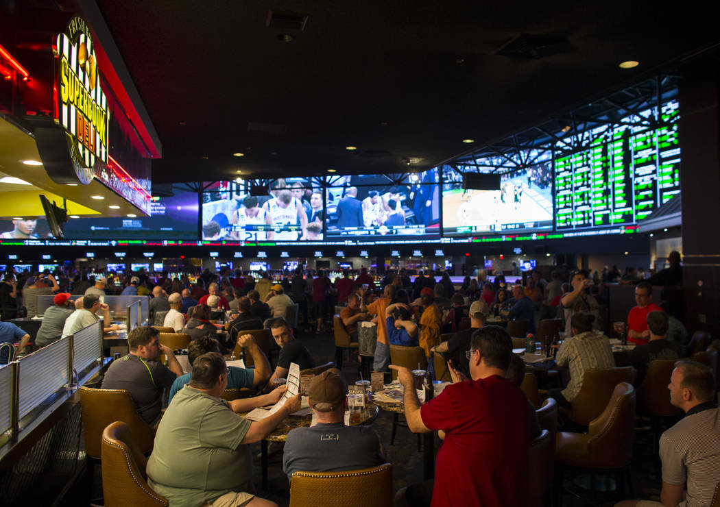 People sit outside of the Superbook Deli during the first day of the NCAA basketball tournament at the Westgate sports book in Las Vegas on Thursday, March 16, 2017. (Chase Stevens/Las Vegas Revie ...