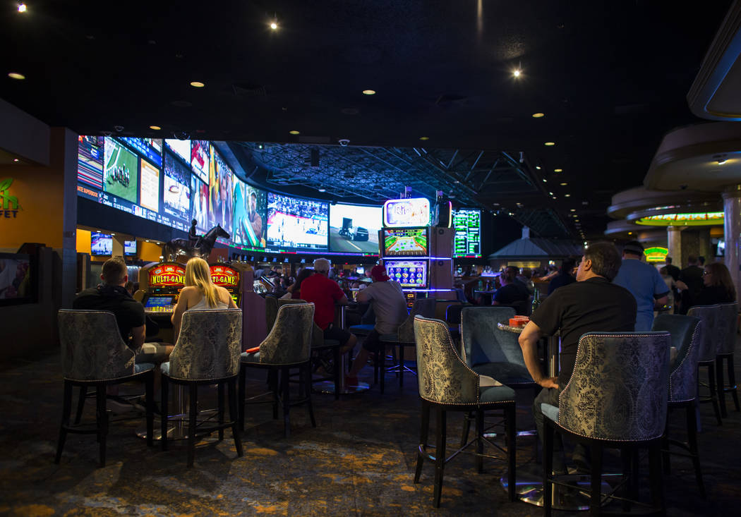 Fans take in the first day of the NCAA basketball tournament at the Westgate sports book in Las Vegas on Thursday, March 16, 2017. (Chase Stevens/Las Vegas Review-Journal) @csstevensphoto