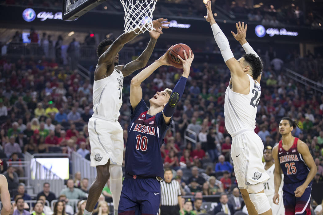 Arizona Wildcats forward Lauri Markkanen (10) goes up for a shot against Oregon Ducks in an NCAA college basketball game for the Pac-12 tournament championship at T-Mobile Arena Saturday, March 11 ...
