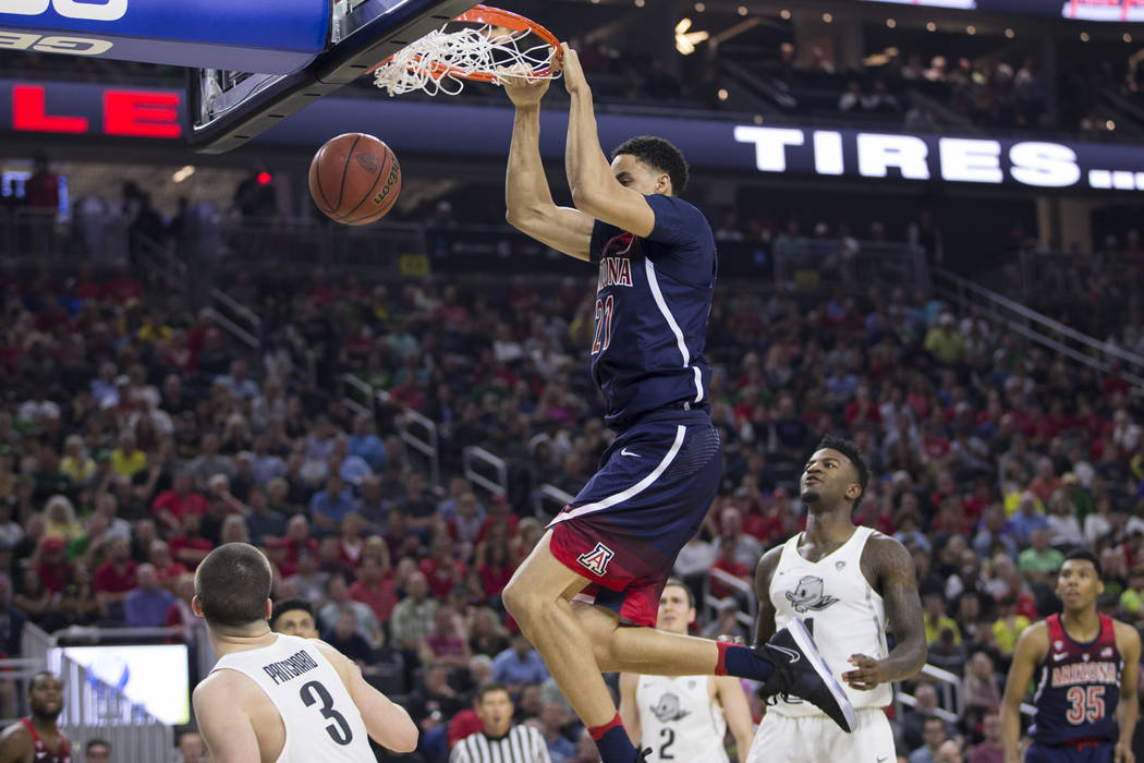 Arizona Wildcats center Chance Comanche (21) dunks the ball against Oregon Ducks in an NCAA college basketball game for the Pac-12 tournament championship at T-Mobile Arena Saturday, March 11, 201 ...