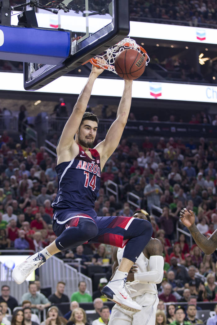 Arizona Wildcats center Dusan Ristic (14) dunks the ball against Oregon Ducks in an NCAA college basketball game for the Pac-12 tournament championship at T-Mobile Arena Saturday, March 11, 2017,  ...