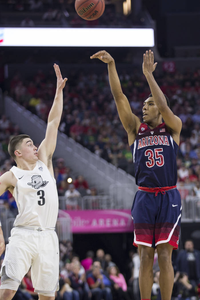 Arizona Wildcats guard Allonzo Trier (35) shoots the ball against Oregon Ducks guard Payton Pritchard (3) in an NCAA college basketball game for the Pac-12 tournament championship at T-Mobile Aren ...