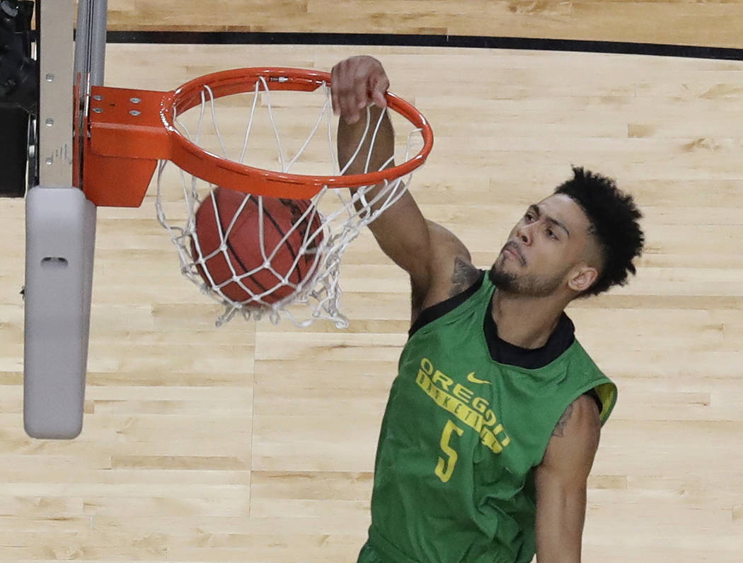 Oregon's Tyler Dorsey dunks during a practice session for their NCAA Final Four tournament college basketball semifinal game Friday, March 31, 2017, in Glendale, Ariz. (AP Photo/David J. Phillip)