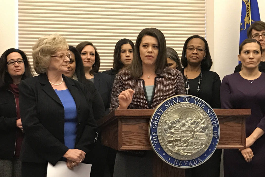 Democratic lawmakers, including Sen. Joyce Woodhouse, left, and Assembly Majority Floor Leader Teresa Benitez-Thompson at the podium, talk about women's issues at the Nevada Legislature on Monday. ...