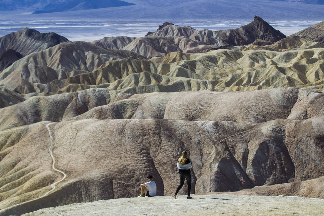 People at Zabriskie Point in Death Valley National Park on Tuesday, Feb. 28, 2017. The cover ar ...