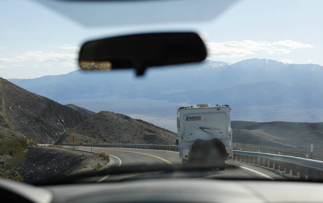 An RV drives along California State Route 190 in of Death Valley National Park on Tuesday, Feb. ...