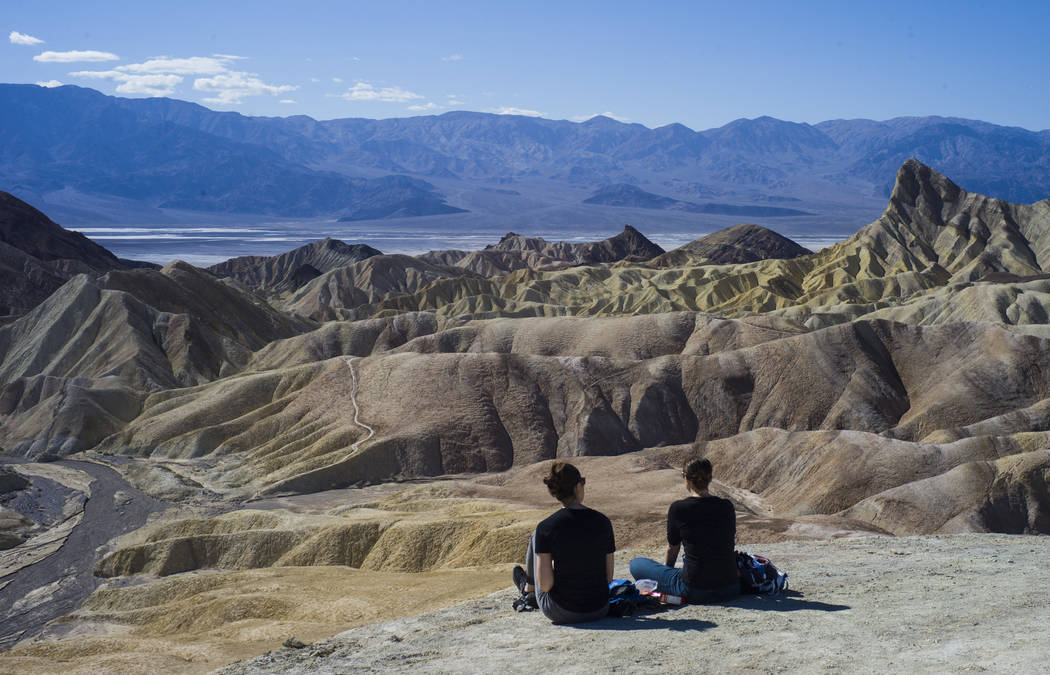 People at Zabriskie Point in Death Valley National Park on Tuesday, Feb. 28, 2017. The cover ar ...