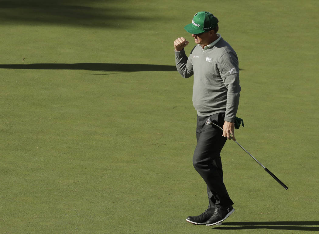 Charley Hoffman reacts to a birdie putt on the 15th hole during the first round for the Masters golf tournament Thursday, April 6, 2017, in Augusta, Ga. (AP Photo/Charlie Riedel)