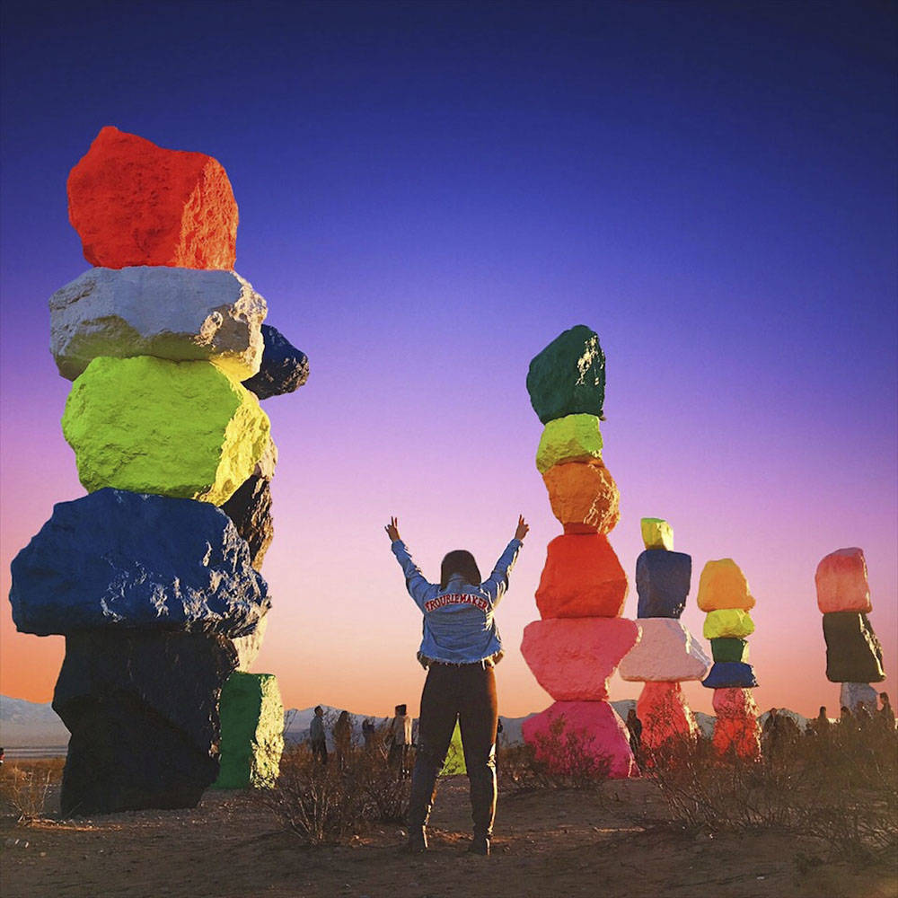 A “Seven Magic Mountains” visitor strikes a victory pose in December 2016’s Instagram win ...