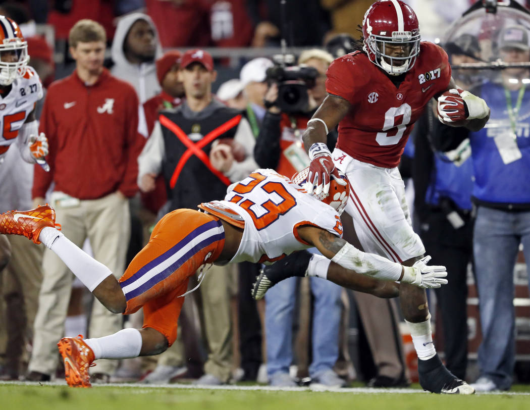 Alabama's Bo Scarbrough runs for a touchdown during the first half of the NCAA college football playoff championship game against Clemson Monday, Jan. 9, 2017, in Tampa, Fla. (AP Photo/John Bazemore)