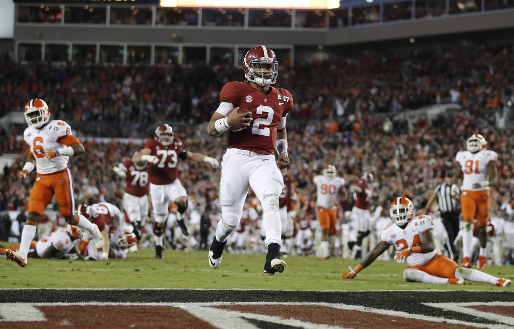 Alabama's Jalen Hurts runs for a touchdown during the second half of the NCAA college football playoff championship game against Clemson Tuesday, Jan. 10, 2017, in Tampa, Fla. (AP Photo/John Bazemore)