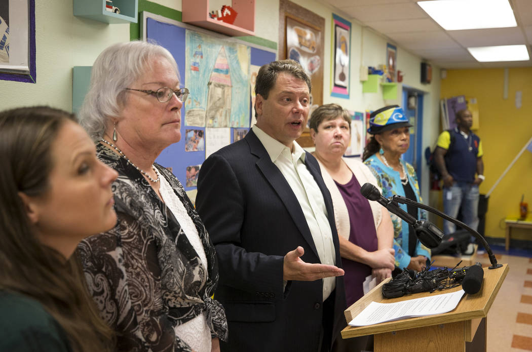 Clark County School District Superintendent Pat Skorkowsky, third from left, announces he will be retiring after his contract ends during a press conference held at Walter Bracken Academy on Thurs ...