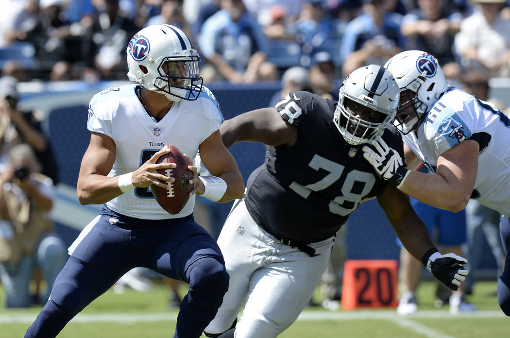Tennessee Titans quarterback Marcus Mariota (8) is pressured by Oakland Raiders defensive tackle Justin Ellis (78) in the first half of an NFL football game Sunday, Sept. 10, 2017, in Nashville, T ...