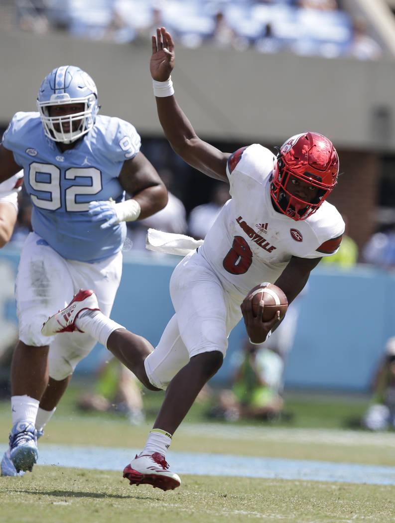 Louisville quarterback Lamar Jackson (8) runs against North Carolina during the first half of an NCAA college football game in Chapel Hill, N.C., Saturday, Sept. 9, 2017. (AP Photo/Gerry Broome)