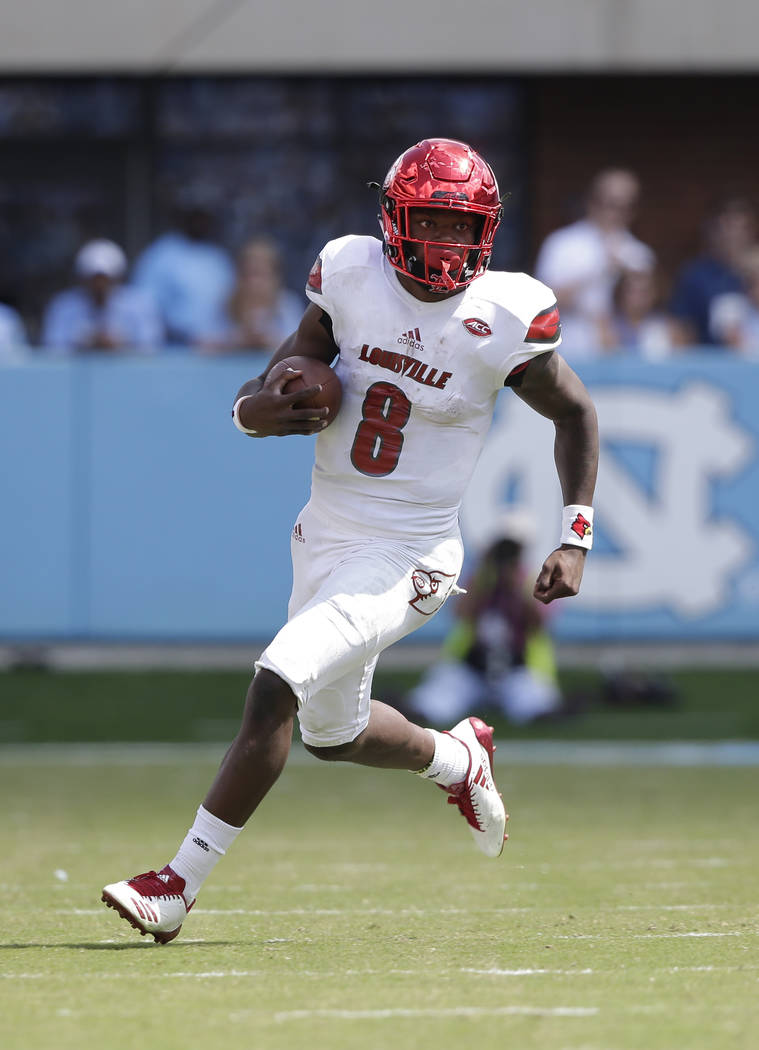 Louisville quarterback Lamar Jackson (8) runs against North Carolina during the first half of an NCAA college football game in Chapel Hill, N.C., Saturday, Sept. 9, 2017. (AP Photo/Gerry Broome)