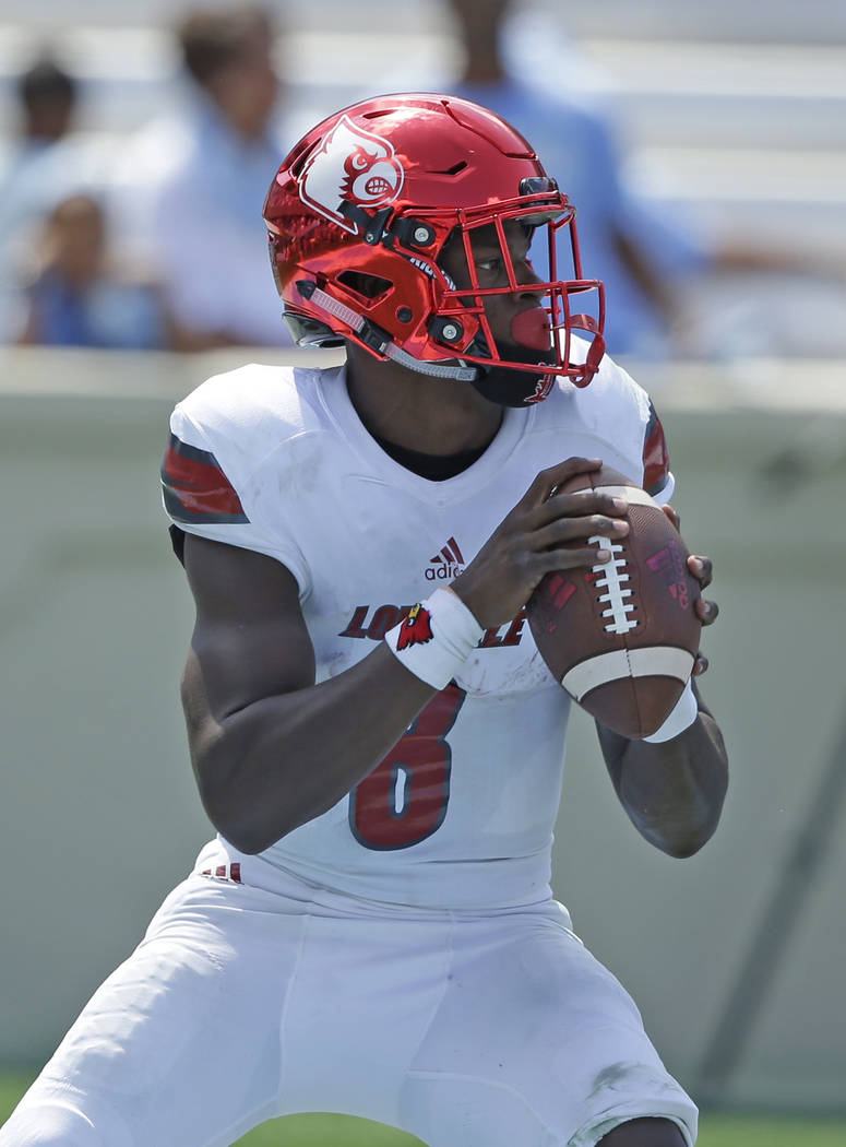 Louisville quarterback Lamar Jackson (8) looks to pass against North Carolina during the first half of an NCAA college football game in Chapel Hill, N.C., Saturday, Sept. 9, 2017. (AP Photo/Gerry  ...