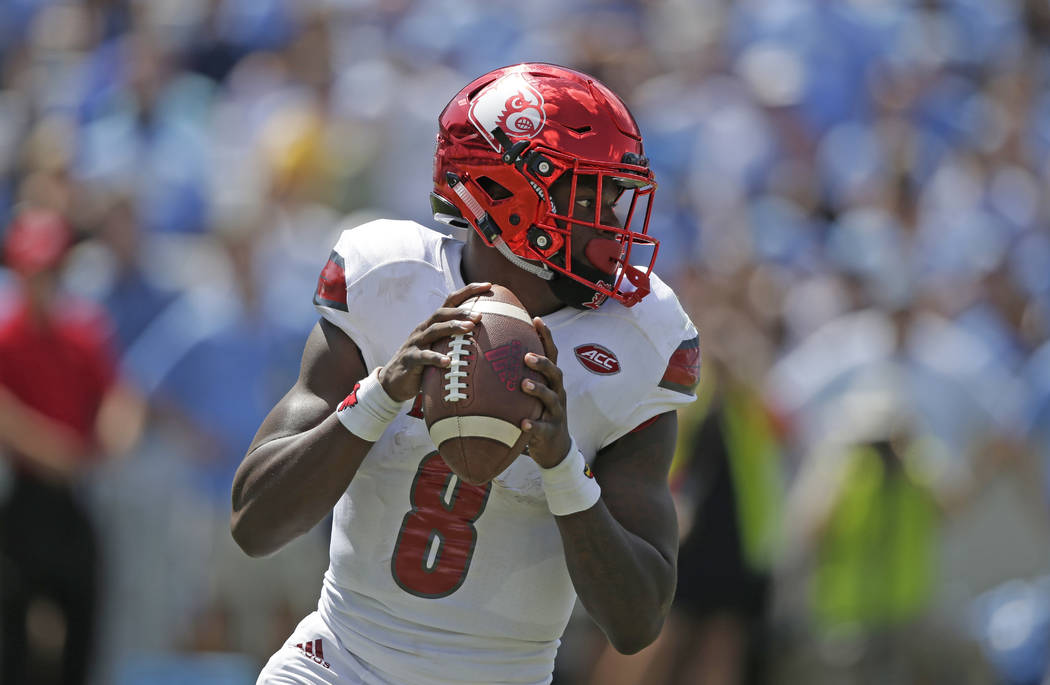 Louisville quarterback Lamar Jackson (8) looks to pass against North Carolina during the first half of an NCAA college football game in Chapel Hill, N.C., Saturday, Sept. 9, 2017. (AP Photo/Gerry  ...