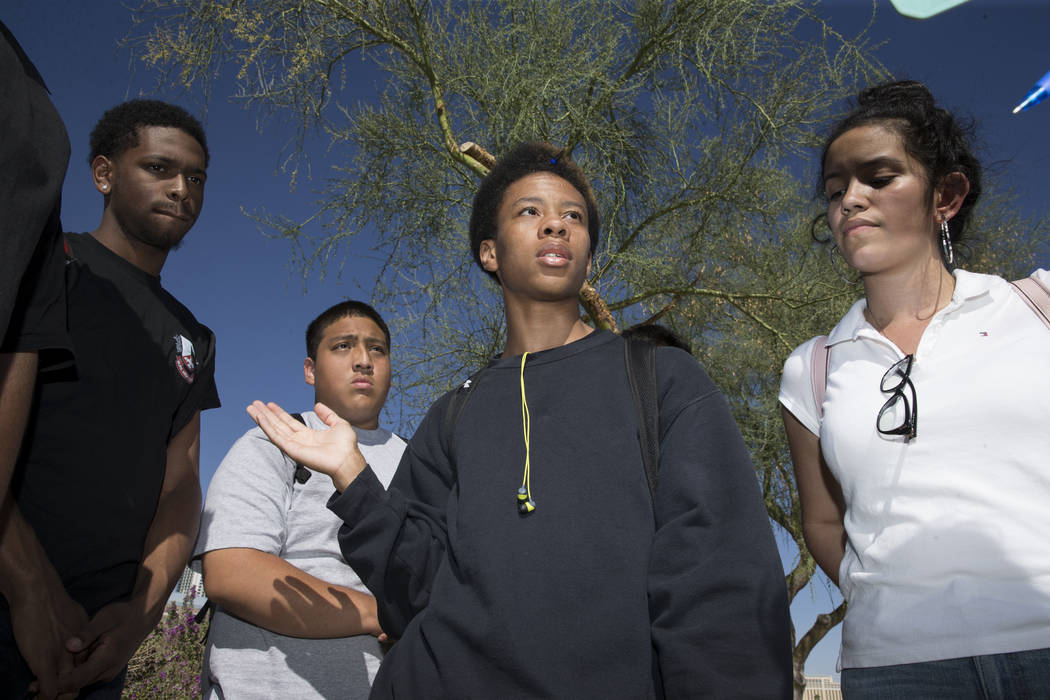 Naseem Evans, 18, center, student concerned about budget cuts at Burk Horizon High School, is interviewed outside of his school in Las Vegas, Wednesday, Sept. 20, 2017. The school is facing budget ...