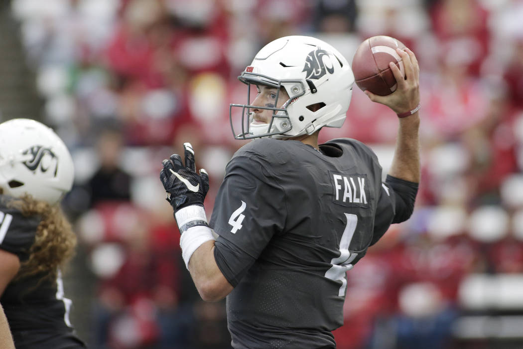 Washington State quarterback Luke Falk (4) throws a pass during the second half of an NCAA college football game against Nevada in Pullman, Wash., Saturday, Sept. 23, 2017. (AP Photo/Young Kwak)