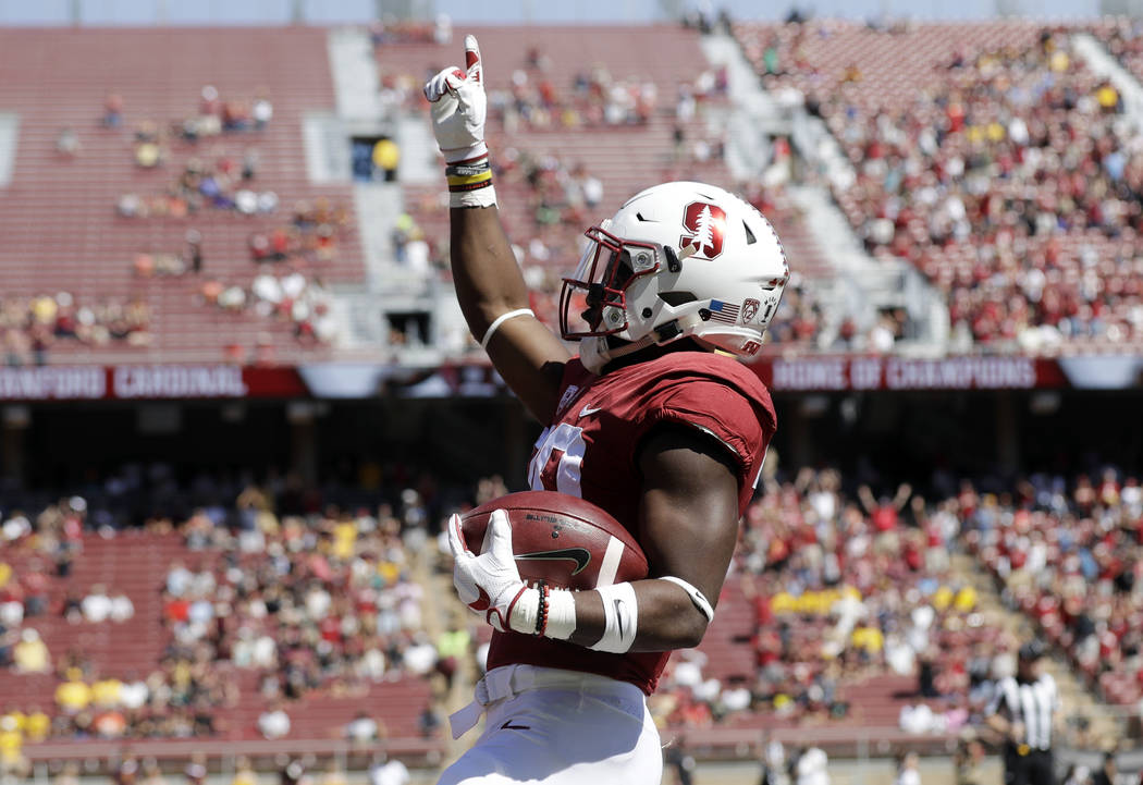 Stanford running back Bryce Love celebrates after scoring on a rushing touchdown against Arizona State during the first quarter of an NCAA college football game Saturday, Sept. 30, 2017, in Stanfo ...