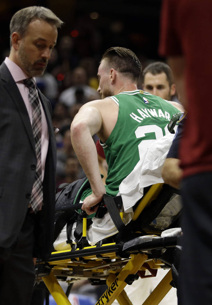 Boston Celtics' Gordon Hayward is carried away in a stretcher in the first half of an NBA basketball game against the Cleveland Cavaliers, Tuesday, Oct. 17, 2017, in Cleveland. Just five minutes i ...