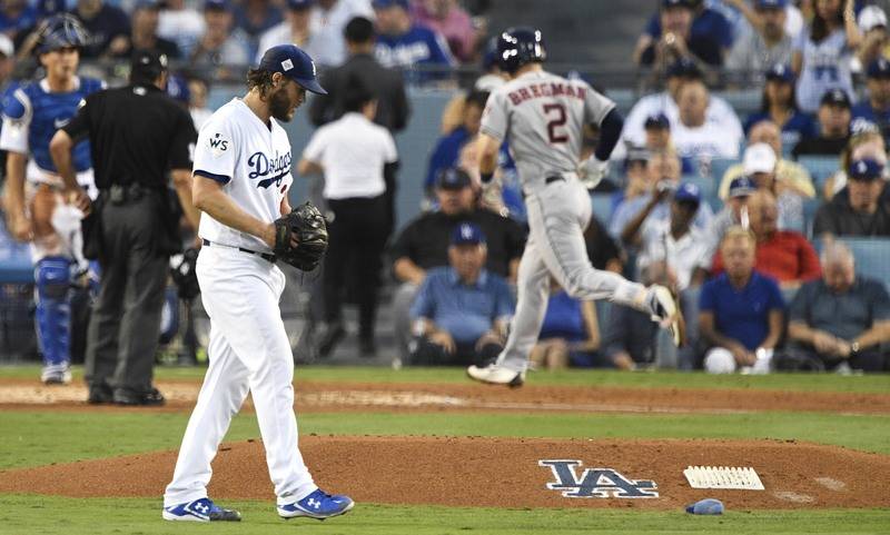 Oct 24, 2017; Los Angeles, CA, USA; Los Angeles Dodgers starting pitcher Clayton Kershaw (22) reacts as Houston Astros third baseman Alex Bregman (2) runs in a home run in the fourth inning in gam ...