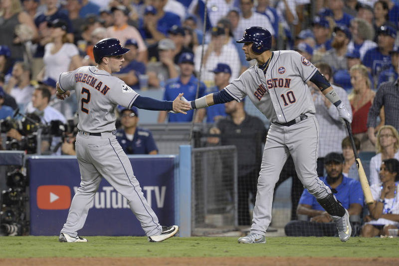 Oct 25, 2017; Los Angeles, CA, USA; Houston Astros third baseman Alex Bregman (2) celebrates with first baseman Yuli Gurriel (10) after scoring a run against the Los Angeles Dodgers in game two of ...