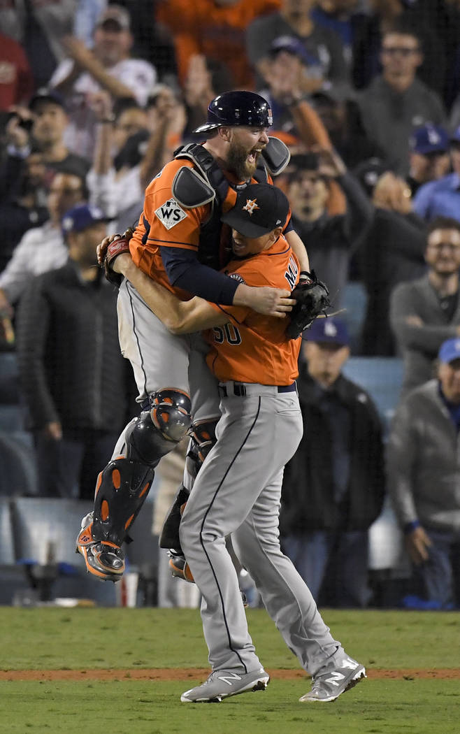 Houston Astros catcher Brian McCann and starting pitcher Charlie Morton celebrate after win against the Los Angeles Dodgers in Game 7 of baseball's World Series Wednesday, Nov. 1, 2017, in Los Ang ...