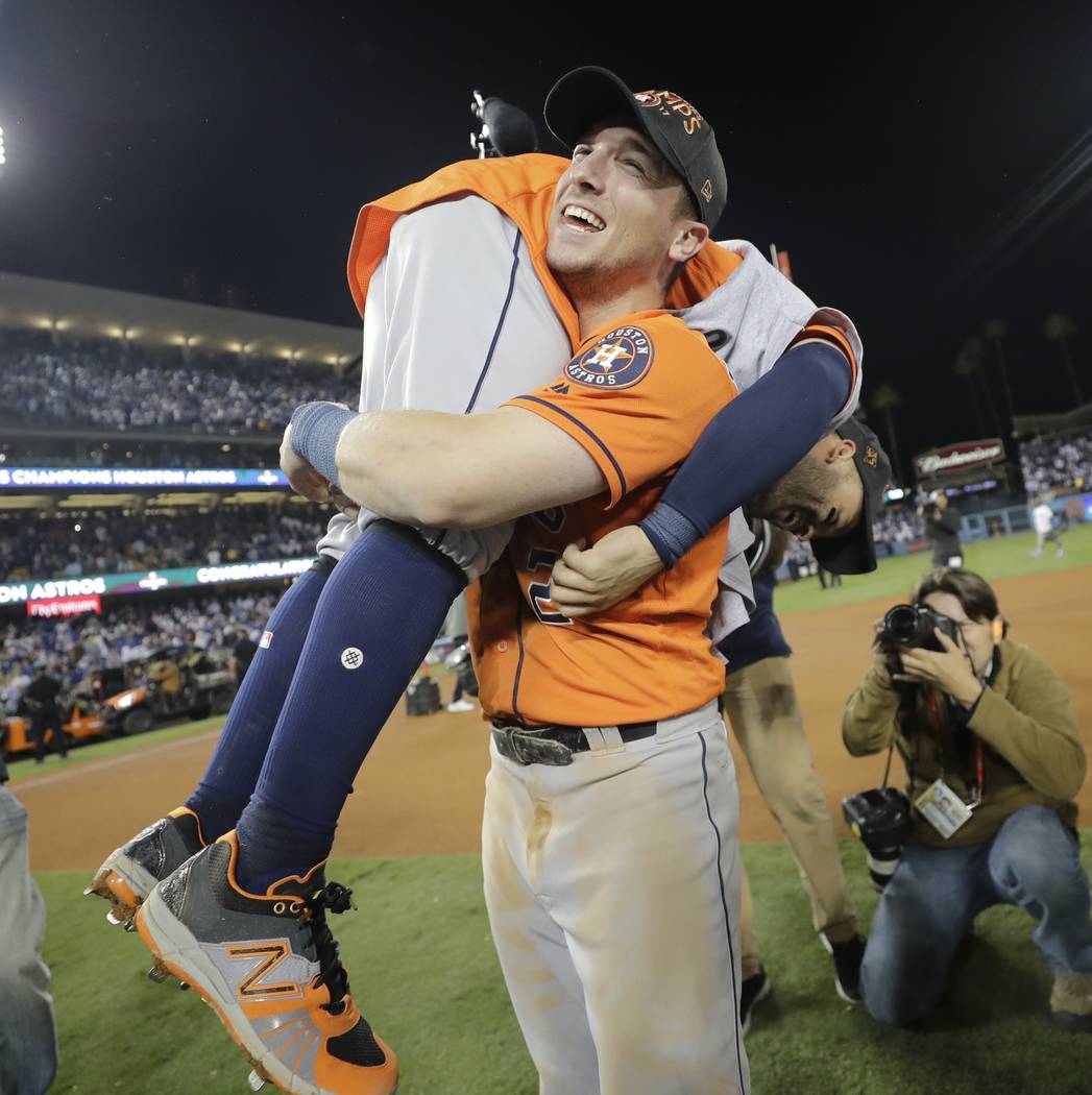Houston Astros' Jose Altuve and Alex Bregman celebrate after Game 7 of baseball's World Series against the Los Angeles Dodgers Wednesday, Nov. 1, 2017, in Los Angeles. The Astros won 5-1 to win th ...