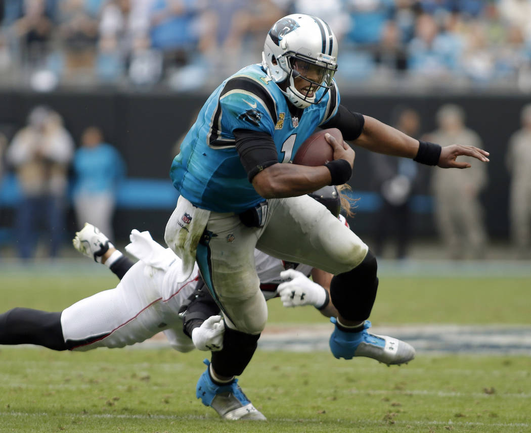 Carolina Panthers' Cam Newton (1) runs against the Atlanta Falcons in the second half of an NFL football game in Charlotte, N.C., Sunday, Nov. 5, 2017. (AP Photo/Bob Leverone)