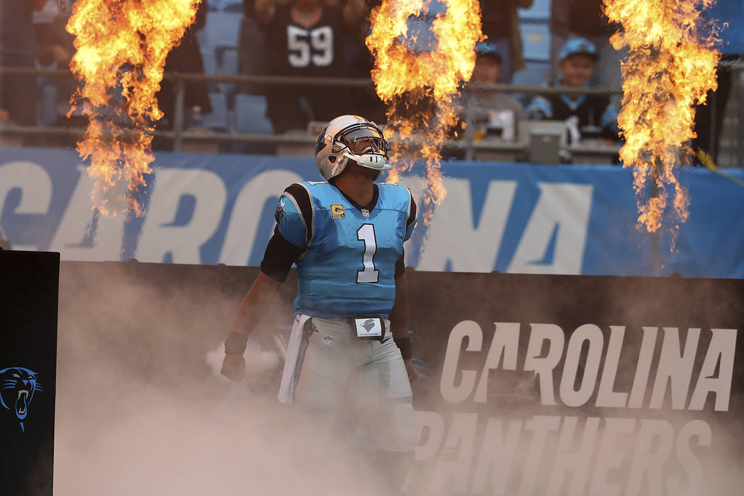 Carolina Panthers quarterback Cam Newton takes the field on the way to beating the Atlanta Falcons 20-17 in a NFL football game on Sunday, Nov. 5, 2017, in Charlotte. (Curtis Compton/Atlanta Journ ...